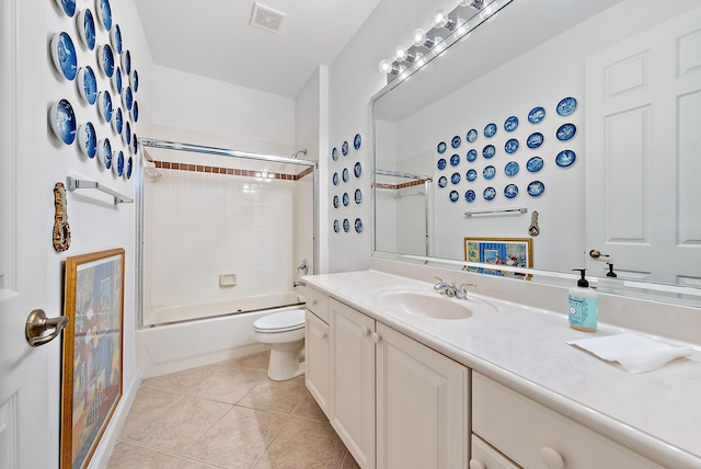 full bathroom with tile patterned floors, vanity, shower / tub combination, and toilet