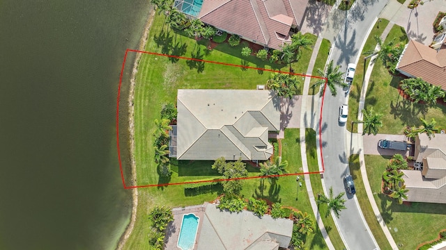 birds eye view of property featuring a water view