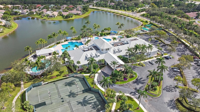 birds eye view of property with a water view