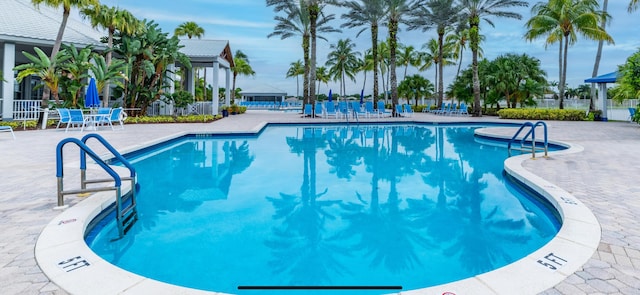 view of swimming pool featuring a patio