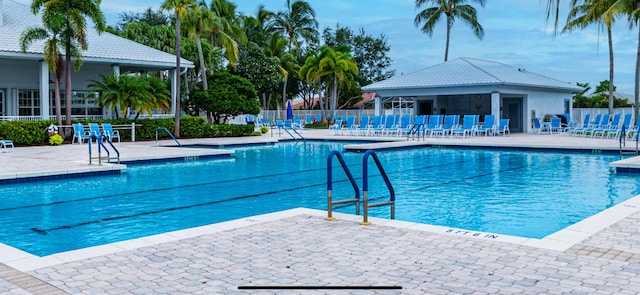 view of swimming pool featuring a patio area