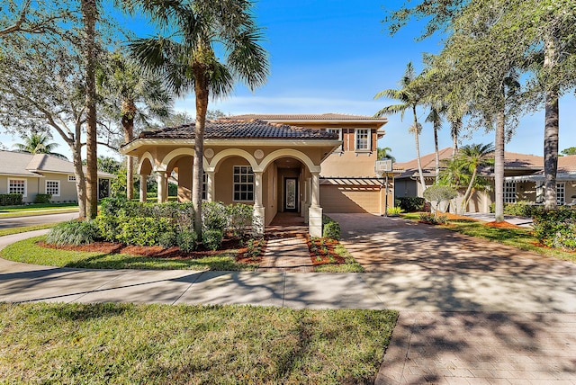 mediterranean / spanish-style house featuring a garage