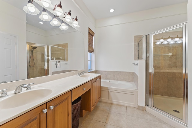 bathroom featuring independent shower and bath, vanity, and tile patterned floors