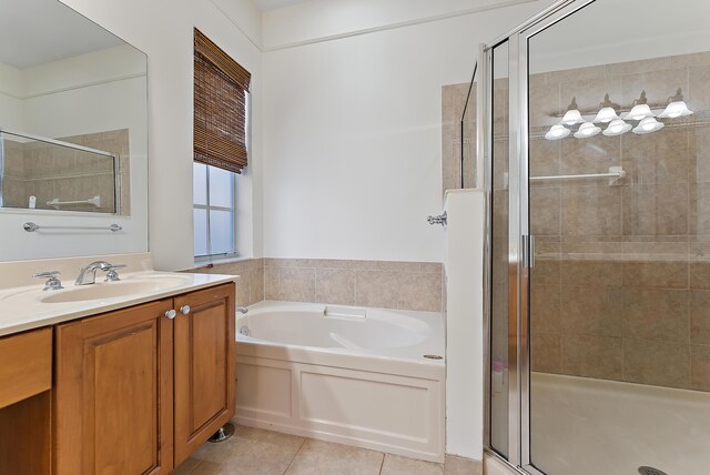 bathroom featuring vanity, separate shower and tub, and tile patterned floors