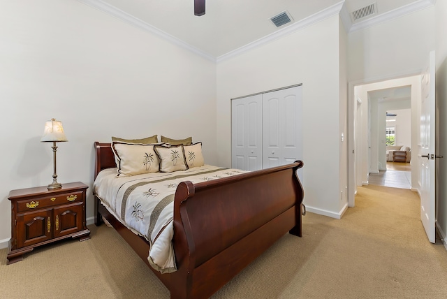 bedroom with crown molding, light colored carpet, a closet, and ceiling fan