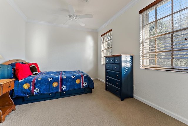 carpeted bedroom with crown molding and ceiling fan