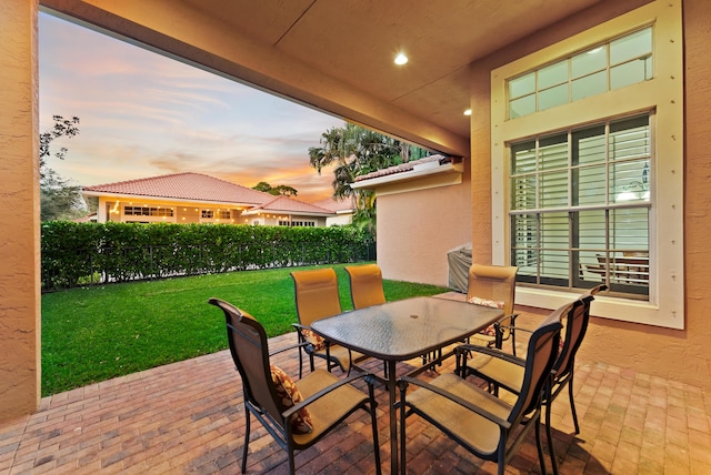 patio terrace at dusk with a yard