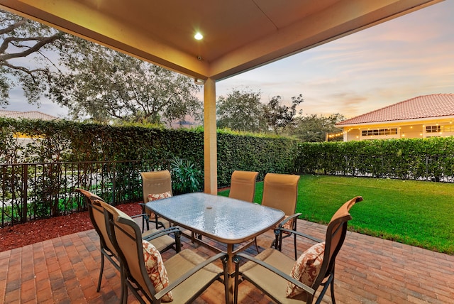 patio terrace at dusk with a yard