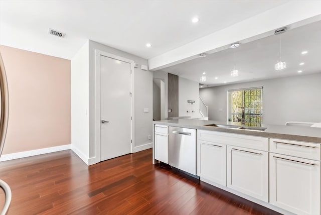 kitchen featuring stainless steel dishwasher, decorative light fixtures, dark hardwood / wood-style flooring, and white cabinets