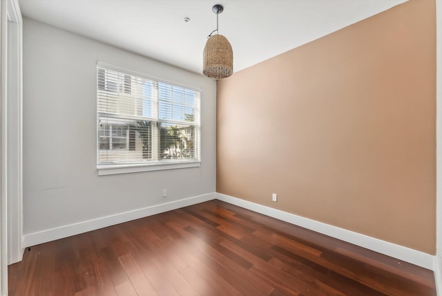 empty room featuring dark hardwood / wood-style floors