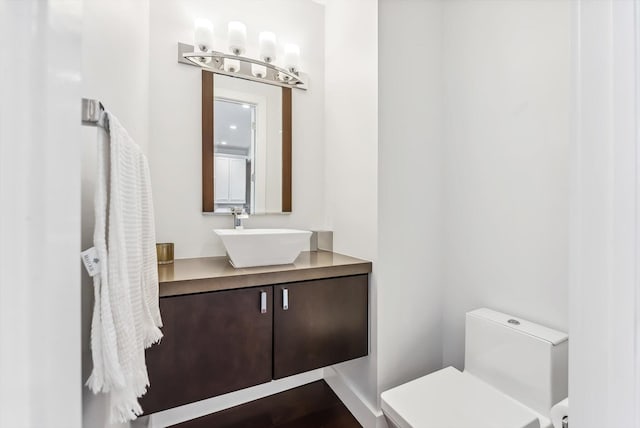 bathroom with vanity and toilet