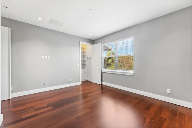 spare room featuring dark hardwood / wood-style flooring