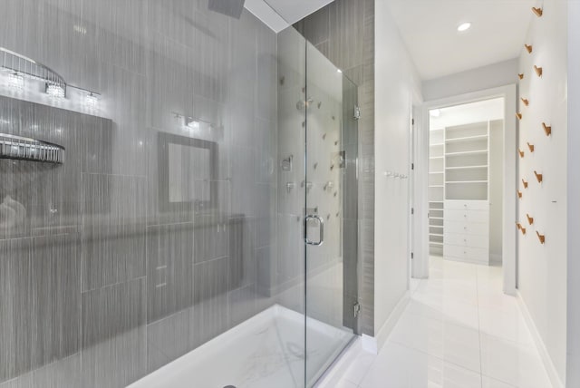 bathroom with tile patterned floors and an enclosed shower