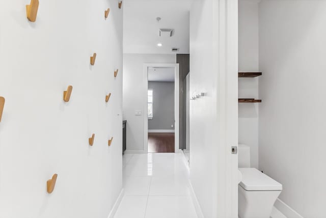 hallway with light tile patterned flooring