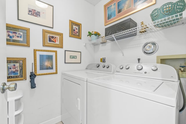 laundry area with independent washer and dryer