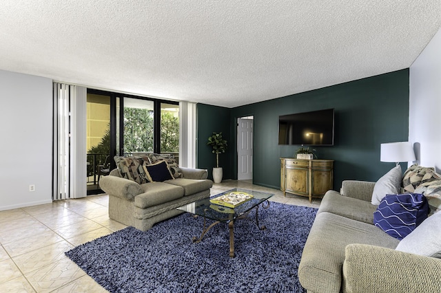 living room featuring expansive windows and a textured ceiling