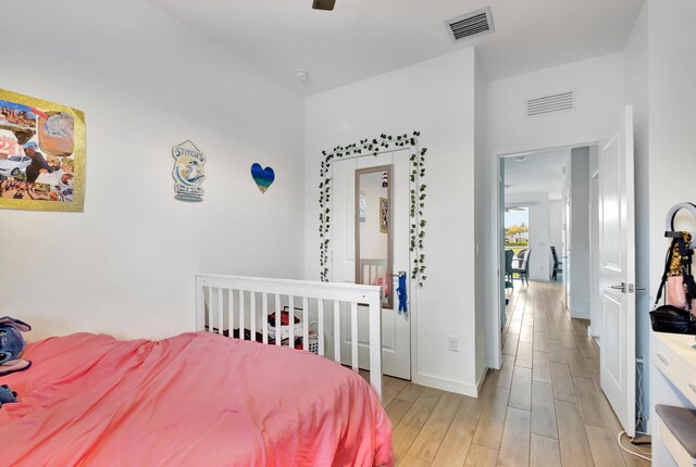 bedroom featuring ceiling fan and light wood-type flooring