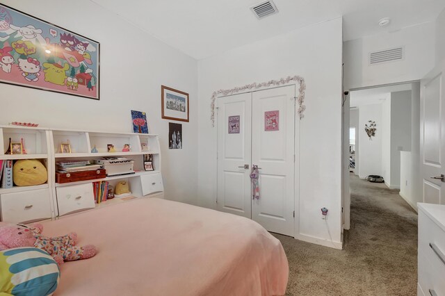 bedroom with light colored carpet