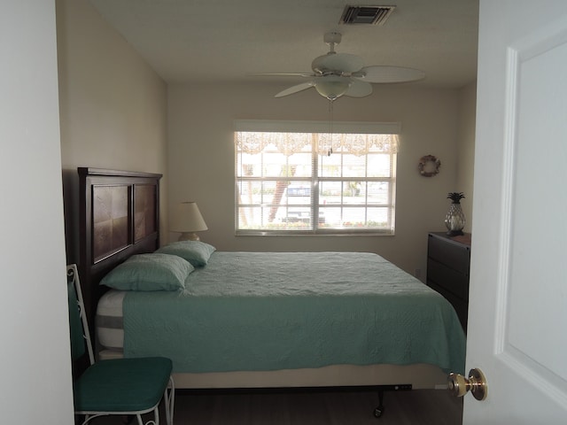 bedroom featuring ceiling fan and wood-type flooring