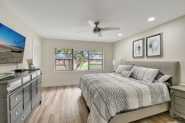 bedroom featuring ceiling fan and light wood-type flooring