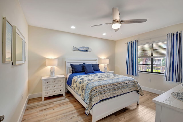 bedroom featuring light hardwood / wood-style floors and ceiling fan