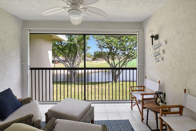 sunroom with ceiling fan and plenty of natural light