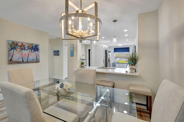 dining space featuring a notable chandelier