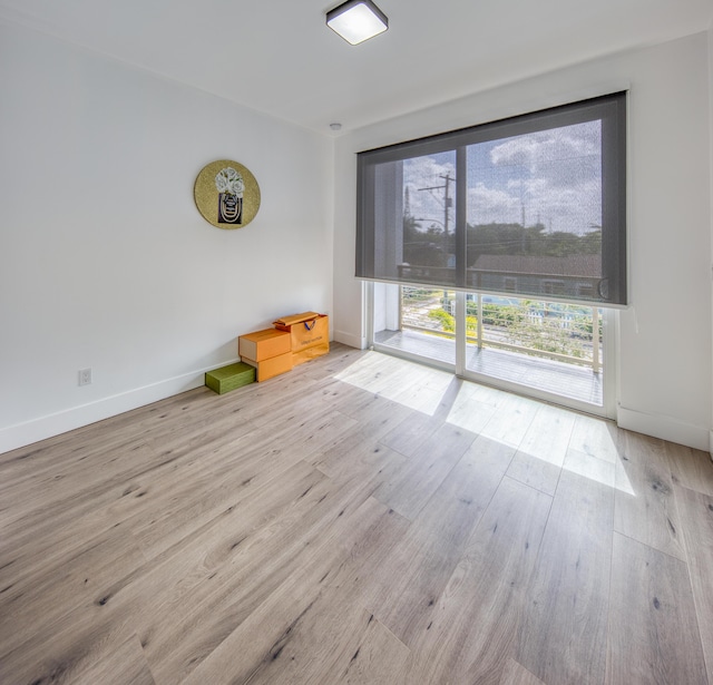 spare room with light wood-type flooring