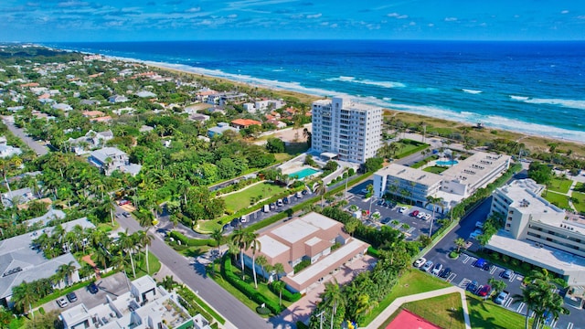 birds eye view of property featuring a view of the beach and a water view