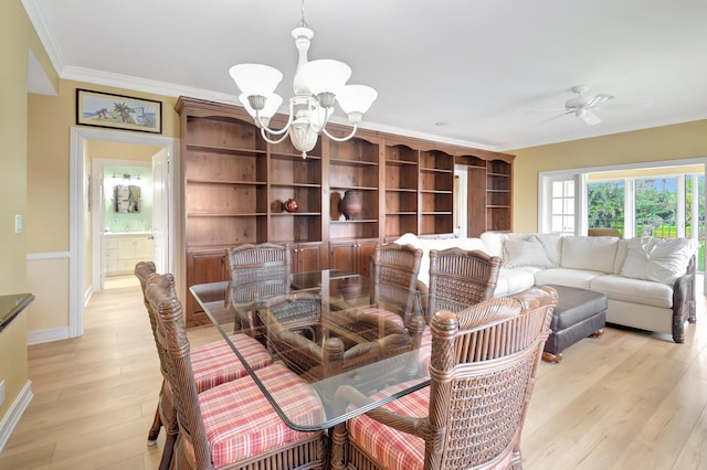 dining space featuring ornamental molding, ceiling fan with notable chandelier, and light wood-type flooring