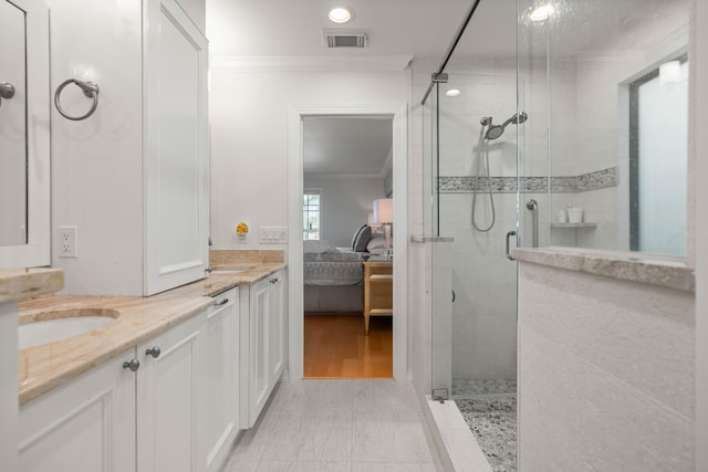 bathroom featuring hardwood / wood-style flooring, vanity, an enclosed shower, and crown molding