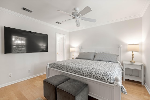 bedroom featuring ceiling fan, light hardwood / wood-style flooring, and ornamental molding