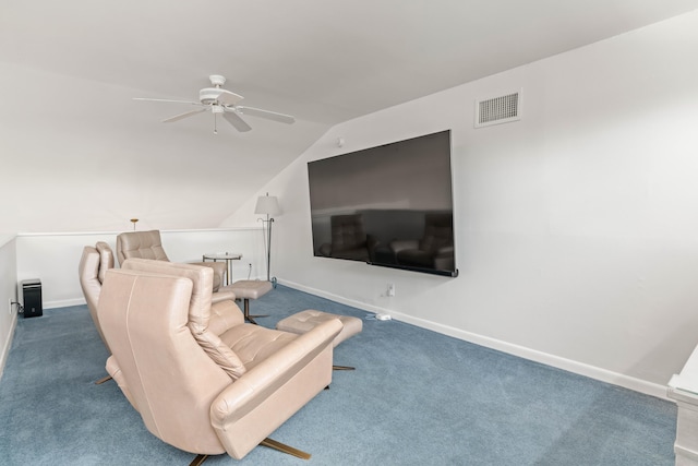 carpeted living room featuring ceiling fan and vaulted ceiling