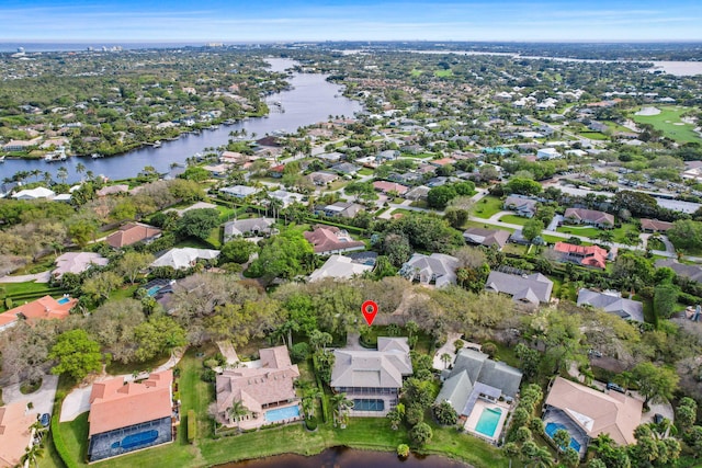 birds eye view of property featuring a water view