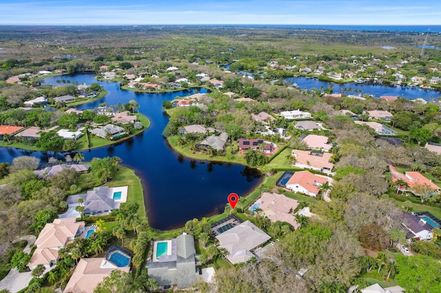 birds eye view of property featuring a water view