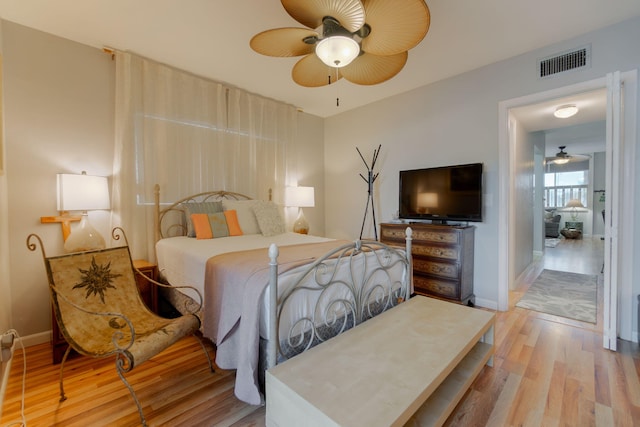 bedroom featuring light hardwood / wood-style floors and ceiling fan