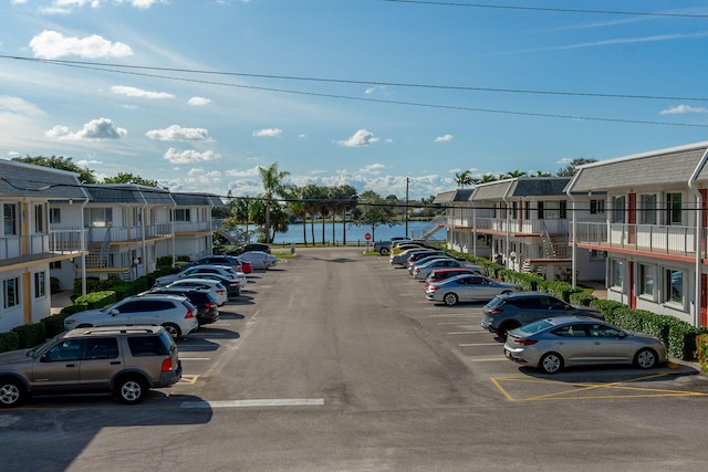 view of vehicle parking featuring a water view