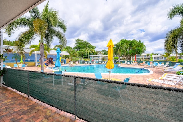 view of swimming pool with a patio area