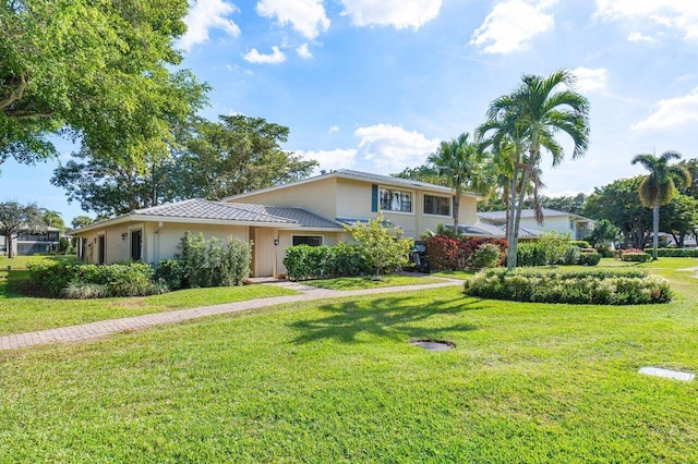 view of front of home with a front lawn