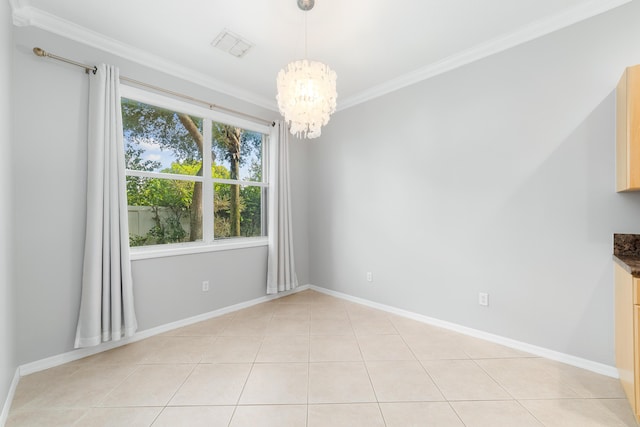 empty room featuring ornamental molding, light tile patterned floors, and an inviting chandelier