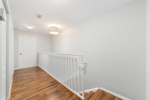 corridor featuring dark hardwood / wood-style floors