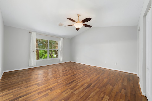 unfurnished room featuring ceiling fan, dark hardwood / wood-style flooring, and lofted ceiling