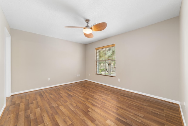 empty room with hardwood / wood-style flooring, ceiling fan, and a textured ceiling