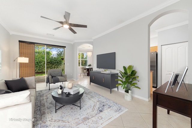 living room featuring ceiling fan, ornamental molding, and light tile patterned floors