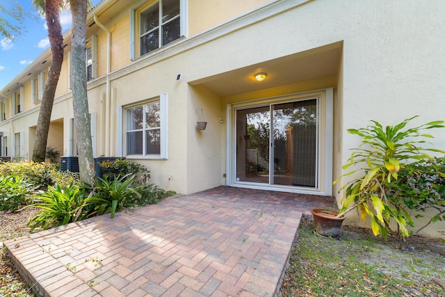 doorway to property featuring a patio area