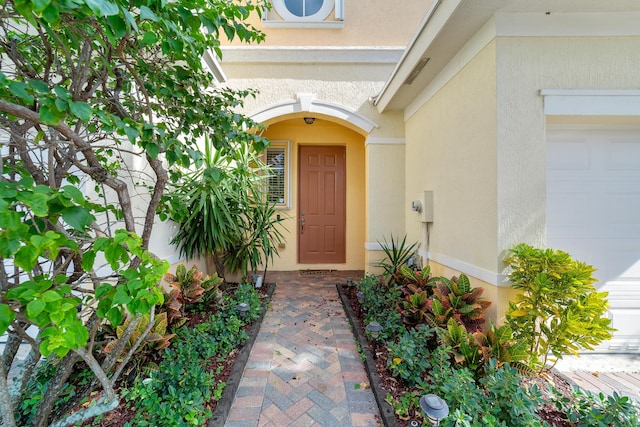 view of exterior entry featuring a garage