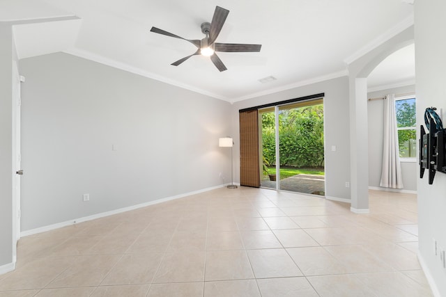 unfurnished room featuring ceiling fan, crown molding, light tile patterned floors, and lofted ceiling