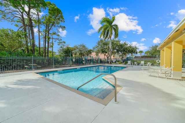 view of swimming pool with a patio area