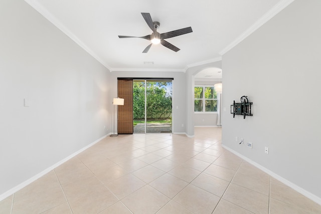 tiled spare room with crown molding and ceiling fan