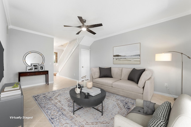 tiled living room with ceiling fan and crown molding